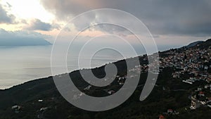 Aerial view over the coastal seaside village Glossa and loutraki port in Skopelos island, Sporades, Greece