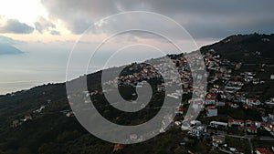 Aerial view over the coastal seaside village Glossa and loutraki port in Skopelos island, Sporades, Greece