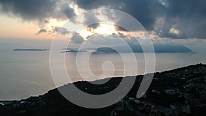 Aerial view over the coastal seaside village Glossa and loutraki port in Skopelos island, Sporades, Greece