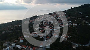 Aerial view over the coastal seaside village Glossa and loutraki port in Skopelos island, Sporades, Greece