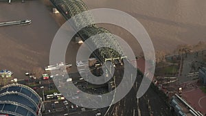 AERIAL: View over Cologne Hohenzollern Bridge and Cathedral in beautiful hazy Sunlight