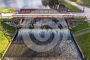 aerial view over dam lock sluice on lake impetuous waterfall