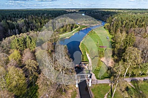 aerial view over dam lock sluice on lake impetuous waterfall