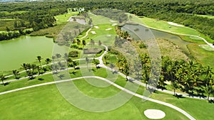 Aerial view over golf course and jungle in tropical caribbean resort.