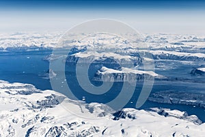 Aerial view over ice mountains in Greenland