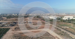Aerial view over Israel open fields with Train passing and agriculture view. Panoramic wide view over agronomy and