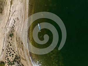 Aerial view over a large sandbar in the green waters of Oyster Bay in Lloyd Harbor on Long Island