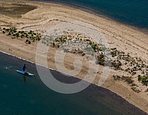 Aerial view over a large sandbar in the green waters of Oyster Bay in Lloyd Harbor on Long Island