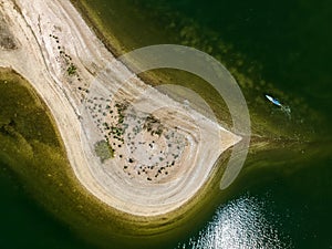 Aerial view over a large sandbar in the green waters of Oyster Bay in Lloyd Harbor on Long Island