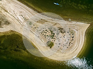 Aerial view over a large sandbar in the green waters of Oyster Bay in Lloyd Harbor on Long Island