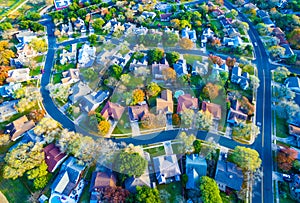 Aerial View Over Modern Suburb Home Community with Fall Colors Curved Streetes