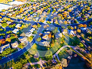 Aerial View Over Modern Suburb Home Community with Fall Colors photo