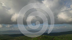 Aerial view over mountains under cloudy sky in summer day in Urla ,cesmealti, izmir