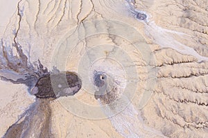 Aerial view over the muddy volcano Paclele Mici and Paclele Mari in Buzau county , natural park in Romania