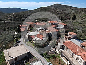 Aerial view over the old traditional stoned buildings and houses in Vorio village located near Kentro Avia and Pigadia Villages in