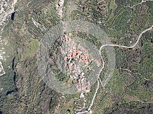 Aerial view over the old traditional stoned buildings and houses in Vorio village located near Kentro Avia and Pigadia Villages in