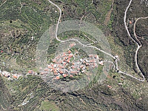 Aerial view over the old traditional stoned buildings and houses in Vorio village located near Kentro Avia and Pigadia Villages in