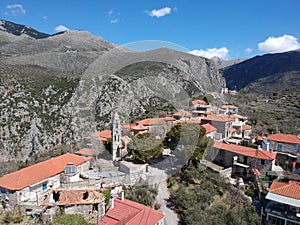 Aerial view over the old traditional stoned buildings and houses in Vorio village located near Kentro Avia and Pigadia Villages in