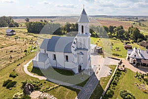 aerial view over othodox or catholic church in countryside