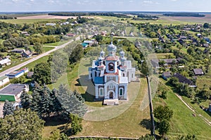 aerial view over othodox or catholic church in countryside