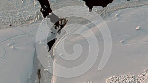 Aerial view over partially frozen sea and small river delta