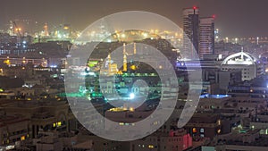 Aerial view over Port Rashid illuminated at night during sand storm timelapse in Dubai, United Arab Emirates photo