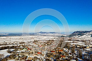 Aerial view over private houses in wintertime