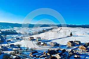 Aerial view over private houses in wintertime