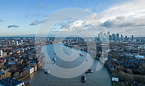 Aerial view over River Thames and Canary Wharf in London - LONDON, UK - DECEMBER 20, 2022