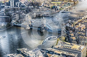 Aerial view over the River Thames and Tower Bridge, London, UK