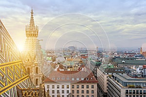 Aerial view over the rooftops of Vienna city from the north tower of St. Stephen`s Cathedral with the cathedral`s famous ornatel