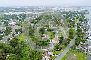 Aerial view over the small town landscape residential sleeping area roof houses in Woodbridge NJ near oil refinery