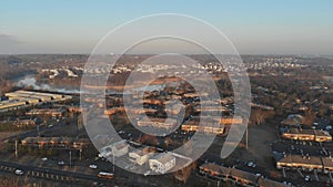 Aerial view over the small town while rooftops in autumn time