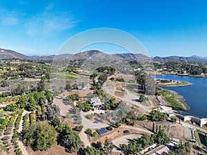 Aerial view over water reservoir and a large dam that holds water. Rancho Santa Fe in San Diego