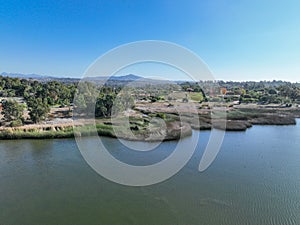 Aerial view over water reservoir and a large dam that holds water. Rancho Santa Fe in San Diego