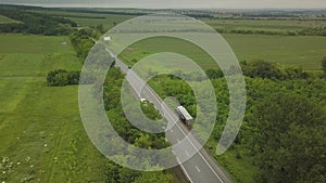 Aerial view of an overturned truck. Car on the side of the highway.