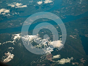 Aerial view of Pacific Ocean and snow mountain