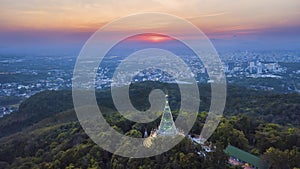 Aerial view of pagoda on the hill in the sunset, The front view is the big city