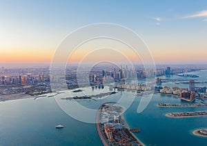 Aerial view of The Palm Jumeirah Island, Dubai Downtown skyline, United Arab Emirates or UAE. Financial district and business area