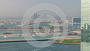 Aerial view of Palm Jumeirah man made island from JBR district before sunset timelapse. Dubai, UAE.