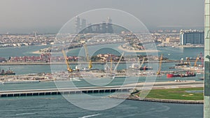 Aerial view of Palm Jumeirah man made island from JBR district before sunset timelapse. Dubai, UAE.