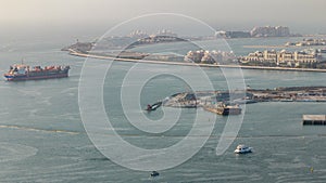 Aerial view of Palm Jumeirah man made island from JBR district before sunset timelapse. Dubai, UAE.