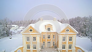 Aerial view of the Palmse manor covered in snow