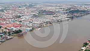 Aerial view pan around Phnom Penh city, showing numerous construction projects, Mekong islands