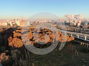 Aerial view panorama of multi-level transport interchange in the center of the big city at dawn. Beautiful panoramic landscape