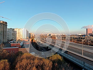 Aerial view panorama of multi-level transport interchange in the center of the big city at dawn. Beautiful panoramic landscape