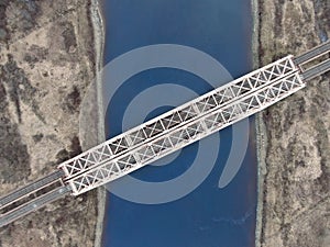 Aerial view panorama of railway bridge over river and high-speed road highway. the picture from the drone