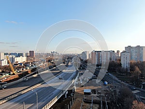 Aerial view panorama on the sunny day of the city landscape of the road highway in the Moscow district of Hovrino. Shot from drone