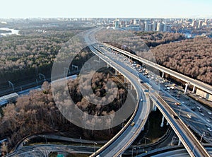 Aerial view panorama on the sunny day of the city landscape of the road highway in the Moscow district of Hovrino. Shot from drone