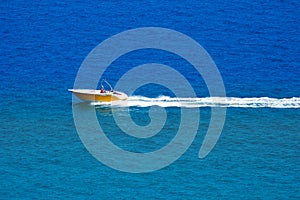 Aerial view of a parasailing boat on the sea